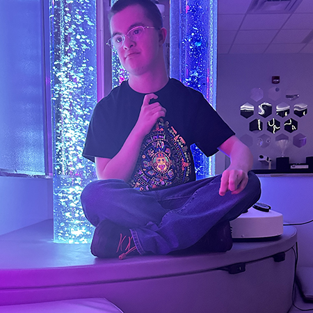Young adult in sensory room
