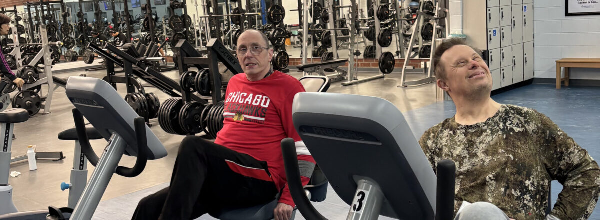 sraclc-adult-recreation-recumbent-cycling Two older adults enjoy physical activity while exercising on recumbent stationary bikes at a recreation facility.